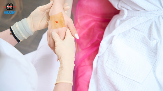 Woman having silicone foam dressing with adhesive border waterproof dressing on her hand.